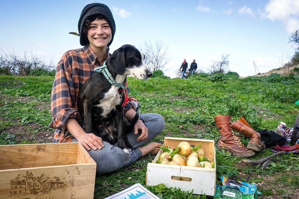 Tania from Spain and her dog Wanda help plant a garden Tania Gypsy in Spain